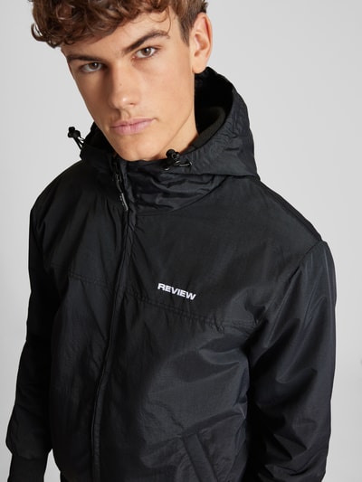 Peek & Cloppenburg REVIEWBlouson mit Eingrifftaschen Modell 'BASIC' in black Im Verkauf